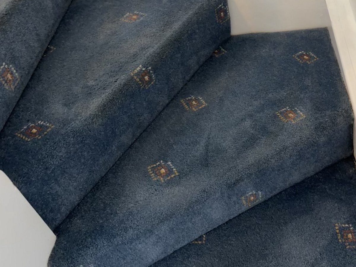 Blue patterned stair carpet, after cleaning